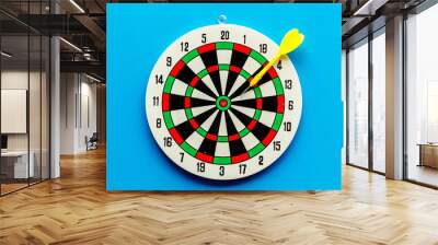 Goal achievement concept. Dartboard and arrows or dart on blue background top view copy space Wall mural