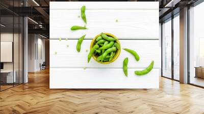 green soybeans or edamame for fresh healthy food on white wooden background top view Wall mural