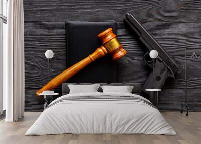 Gun law concept. Hand gun weapon and judges gavel. Crime background Wall mural