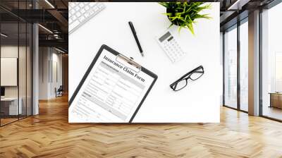 Insurance event concept. Insurance claim form on white office desk top view copy space Wall mural