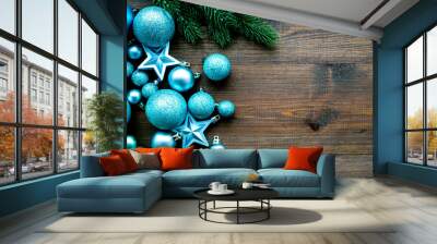 New Year and Christmas atmosphere. Decorate festive christmas tree. Christmas tree decoration. Colorful balls and stars near spruce branch, pine fir on dark wooden background top view space for text Wall mural