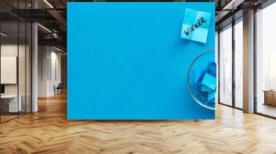 Paper pieces - random winner selection - blue desk top-down copy space Wall mural