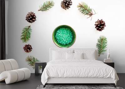 Pine spa cosmetics, products for skin care. Green aromatic spa salt near branches and cones on white background top view Wall mural