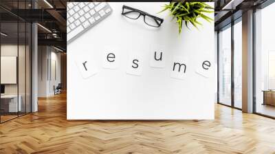 Resume copy on work place with keyboard and glass on white desk background top view Wall mural