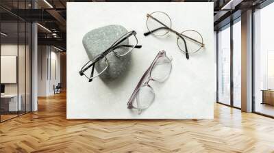 Set of glasses in optics store, top view. Eyesight and vision concept Wall mural