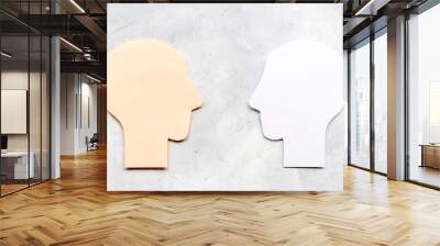 Social communication and connection concept with two paper human heads Wall mural