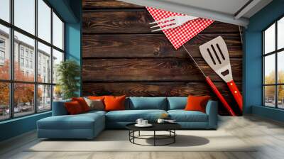 Tongs, fork, spatula for barbecue and grill on wooden background top view copyspace Wall mural