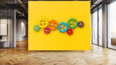 Top view of colorful gears. Corporate work and modern business process concept Wall mural