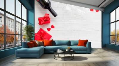 Valentines Day concept with wine, glasses, red present box on white background top-down copy space Wall mural