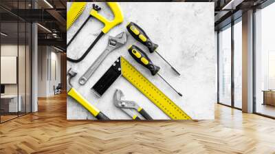 Various repair tools. Must-have for men. Equipment for building. Repair tool kit. Grey background top view pattern copy space Wall mural