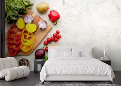 Vegan food cooking with raw vegetables on white stone background top view mock up Wall mural