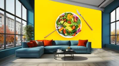 Vegan meal with healthy green salad - avocado and tomatoes in bowl Wall mural