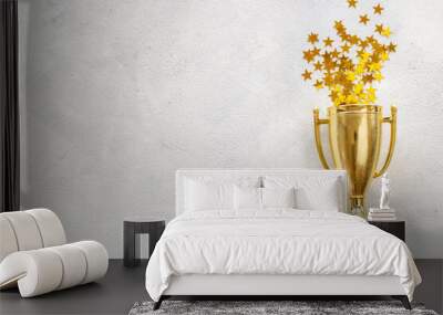 victory concept with winner golden trophy cup and shiny stars Wall mural