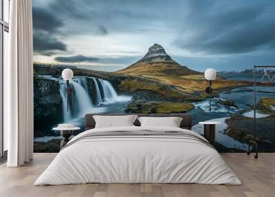 Beautiful landscape of Kirkjufellsfoss with background of remarkable mountain, landmark of iceland during late winter Wall mural