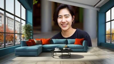 Happy friendly asian non-binary LGBT person smiling to camera Wall mural