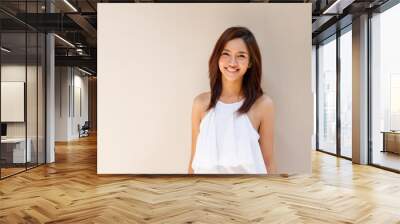 happy smiling woman in casual dress, plain background Wall mural