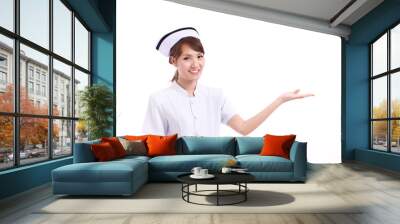 nurse pointing hand to blank space, studio isolated of asian chi Wall mural