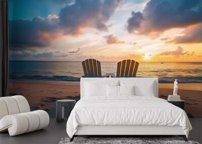 Two deck chairs for sunbathing on the beach, view at sunset. beautiful colorful sunset Wall mural