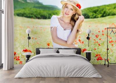 beautiful blonde girl in poppies field Wall mural