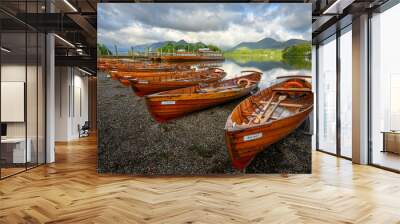 Wooden rowing boats on shoreline of Derwentwater on a Summer morning. Keswick, Lake District, UK. Wall mural