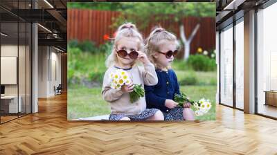 twins girls with bunches of daisies Wall mural