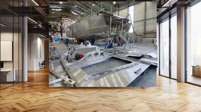 Aluminium hull of a yacht at the shipyard. Airframe. Ship building industry. Super sailing yacht. Netherlands.  Wall mural