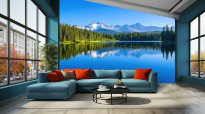 A calm lake mirrors majestic mountains and vibrant greenery under bright blue skies Wall mural