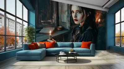 A witch stands in a dimly lit room, clutching a candle and wearing a flowing, vintage dress Wall mural