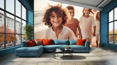 group of kids walking on the beach happily Wall mural