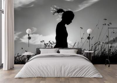 silhouette of woman, nature background Wall mural