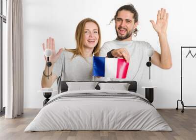 Hello from France. Happy couple in gray t-shirts with french flag isolated on white background. Young people, man and woman. Wall mural