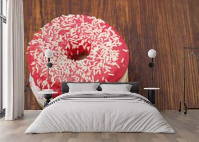 Two donuts on a wooden plank background. Wall mural