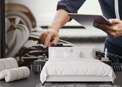 Automobile mechanic repairman hands repairing a car engine automotive workshop with a wrench, car service and maintenance,Repair service. Wall mural