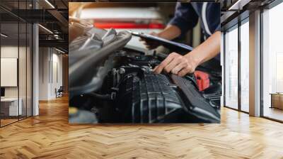 Automobile mechanic repairman hands repairing a car engine automotive workshop with a wrench, car service and maintenance,Repair service. Wall mural