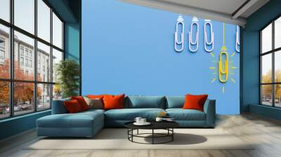 Great ideas concept with paperclip,thinking,creativity,light bulb on blue background,new ideas concept. Wall mural