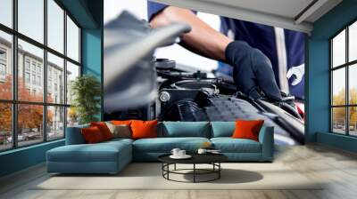 Professional mechanic working on the engine , repairing a car engine automotive workshop with a wrench, car service and maintenance,Repair service. Wall mural