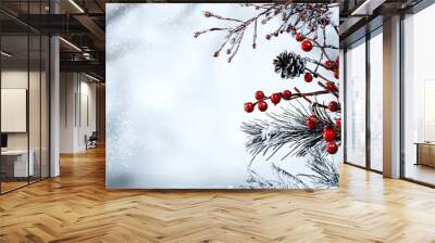 A serene winter scene featuring frosted branches and vibrant red berries, perfect for holiday themes and seasonal decor. Wall mural