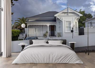 Wooden victorian house Ponsonby Auckland New Zealand. White fence and porch. Wall mural