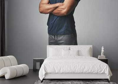 Arms crossed, fitness and portrait of man isolated on studio background for healthy body and workout. Confident, happy and strong athlete, bodybuilder or African person with exercise for sports power Wall mural