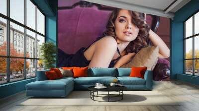 Beautiful woman in a luxurious retro interior in a black dress Wall mural