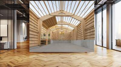 Large timber engineering hall under construction with laminated beams and concrete floor slab Wall mural