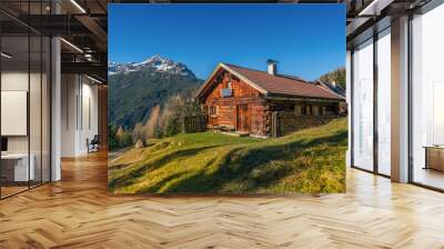 old wooden hut cabin in mountain alps at rural fall landscape Wall mural