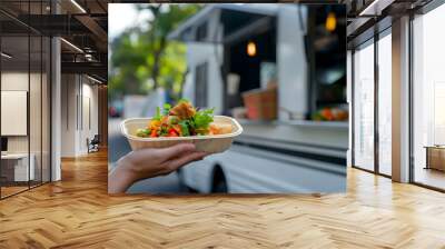 Woman's hands holding open takeaway foam lunch box with healthy fresh green salad in it. Wall mural