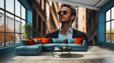 Stylish Man in Sunglasses and Suit Walking in City Street Wall mural