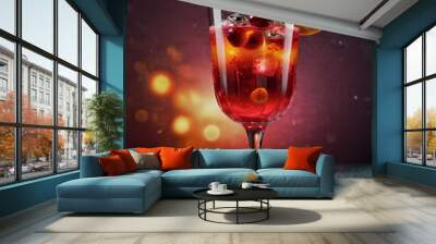 Red cocktail glass, orange slices and berries Wall mural