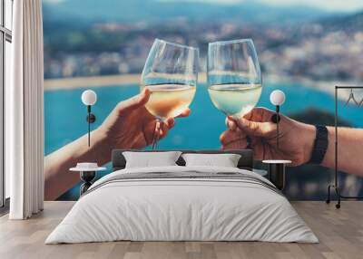 Drink two glasses white wine sea nature holidays, closeup romantic couple toast with alcohol, happy people cheering fun vacation enjoying travel time together friendship love concept congratulations Wall mural