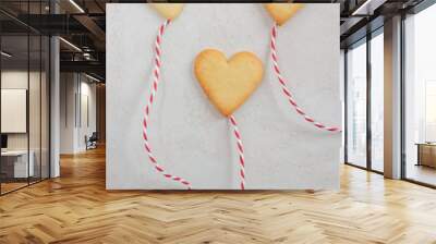 Valentines Day Concept: closeup of fresh baked heart shaped cookies on a table Wall mural