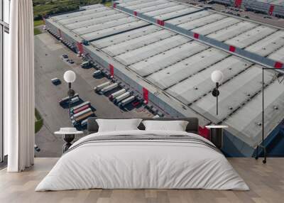 Aerial view of trucks loading at logistic center Wall mural