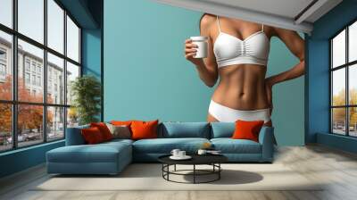 Photo of a woman's torso, Healthy woman's belly or slim model,white skin, stomach, wearing a bra, showing weight loss, good health. With weight loss or nutrition kit on studio background,Generative AI Wall mural