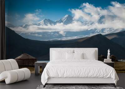 The yurt village in front of Karakul Lake in Xinjiang Uighur Autonomous Region of China is the highest lake of the Pamir plateau, with Muztagh Ata peak of the Kunlun mountains, in the background. Wall mural